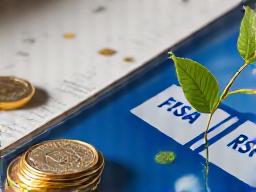 Open bank book and coins, symbolizing Canadian banking and savings accounts.